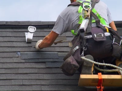 Roofer installing a shingle roof in calgary