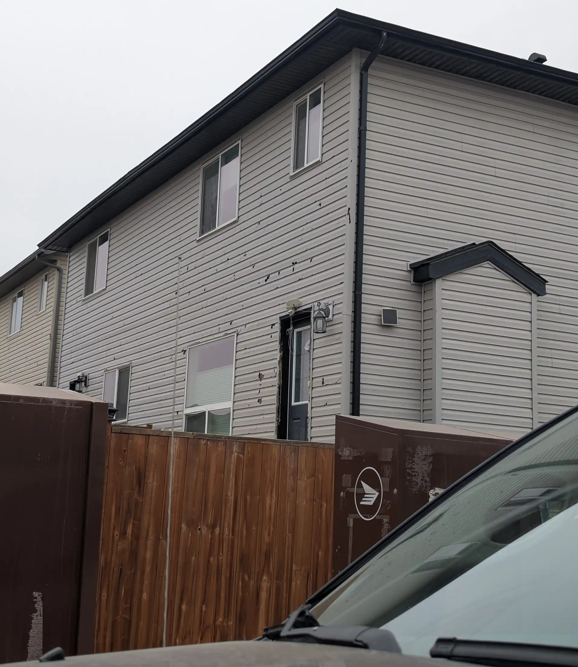 Blueprint Construction contractor providing a siding estimate for a Calgary home