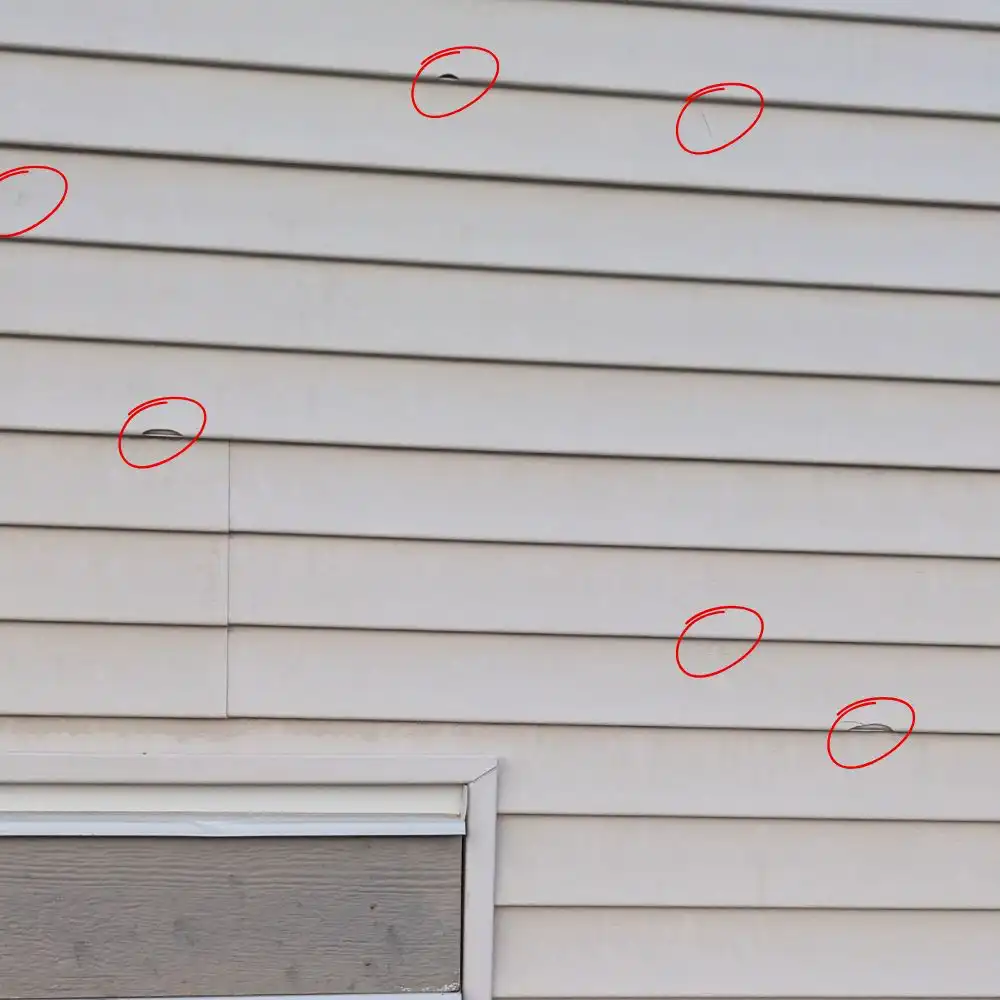 Blueprint Construction contractor inspecting and preparing exterior walls before siding installation in Calgary