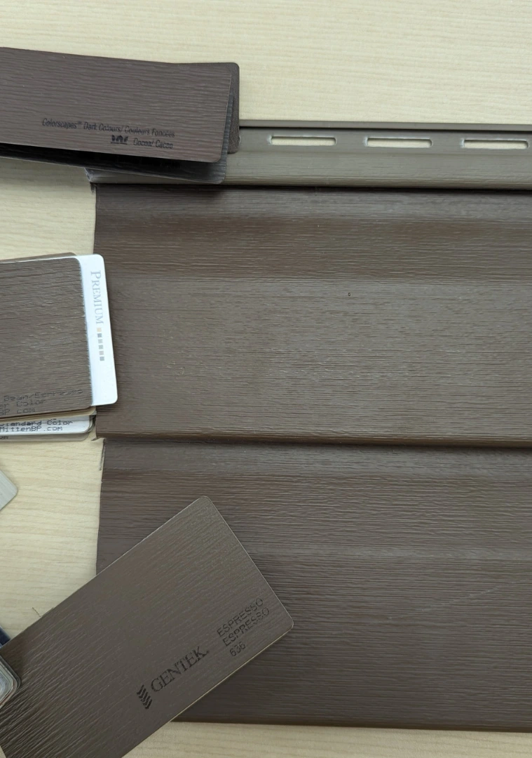 Siding color selection for Cochrane home exterior by Blueprint Construction