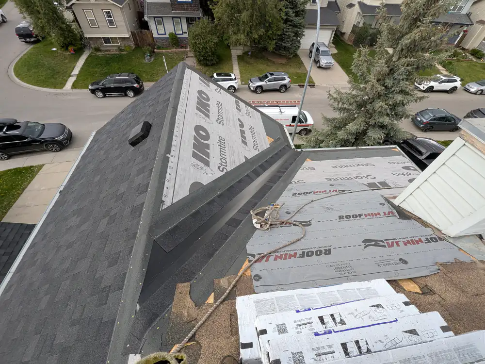 IKO ice and water membrane and synthetic underlayment on bare roof decking during a roof replacement in Calgary